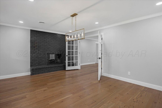 4400 Gem Lake Rd, Amarillo, TX 79106 - unfurnished living room featuring ornamental molding, a fireplace, recessed lighting, wood finished floors, and french doors