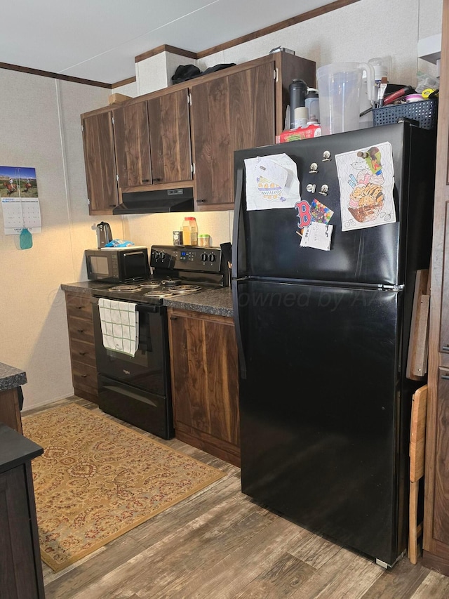 kitchen featuring crown molding, light hardwood / wood-style floors, dark brown cabinets, and black appliances