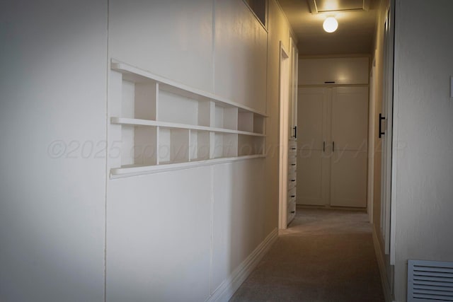 hallway with carpet flooring