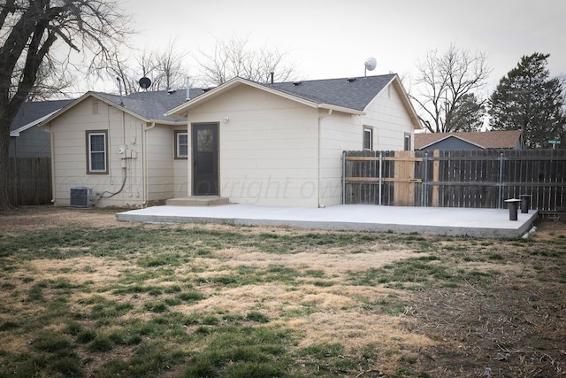 back of house with central AC and a patio area