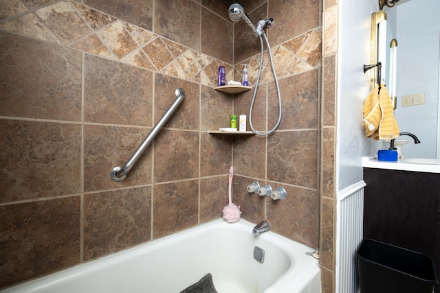 full bath with washtub / shower combination and a sink