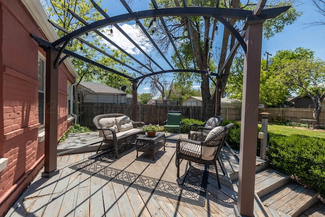 fenced backyard with an outdoor living space and a pergola