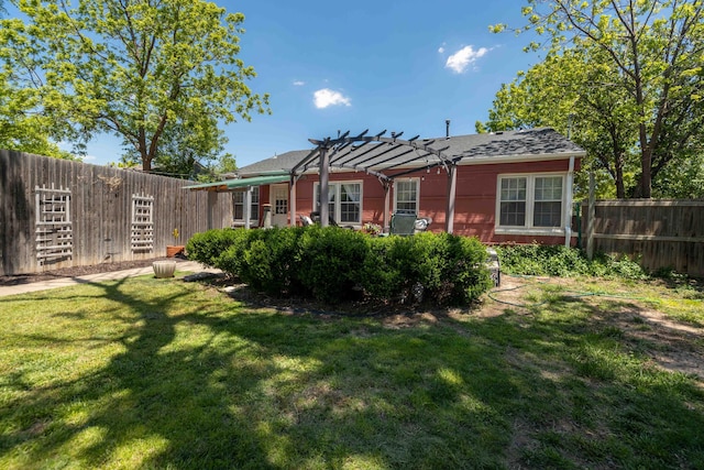 rear view of property featuring a pergola