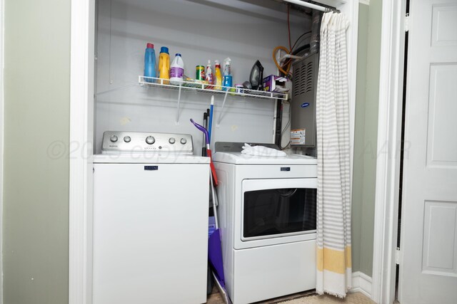 laundry room with washer and clothes dryer