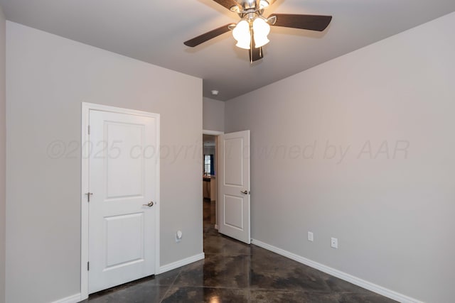 9920 Otis Ct, Amarillo, TX 79119 - unfurnished bedroom featuring baseboards, concrete flooring, and a ceiling fan