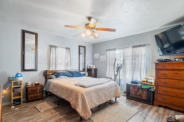 3616 NE 21st Ave, Amarillo, TX 79107 - bedroom with wood finished floors and a ceiling fan