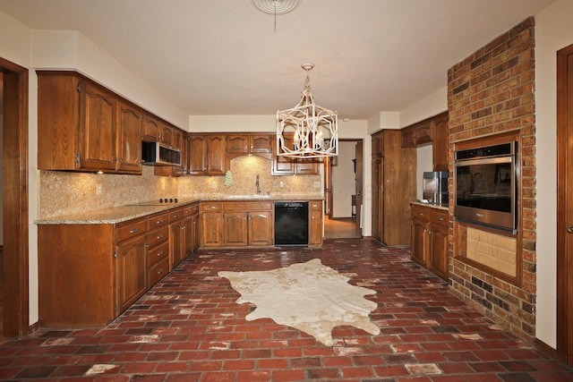 4410 Chandler Dr, Amarillo, TX 79109 - kitchen featuring black appliances, a sink, a chandelier, backsplash, and brick flooring