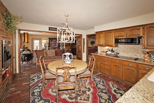 4410 Chandler Dr, Amarillo, TX 79109 - dining room with brick floors and a chandelier