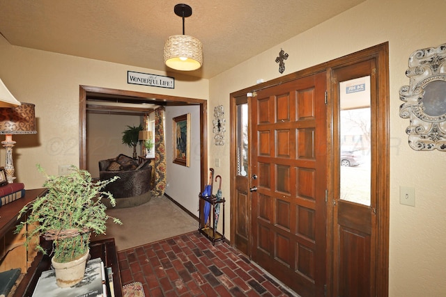4410 Chandler Dr, Amarillo, TX 79109 - entryway featuring brick floors and a textured ceiling