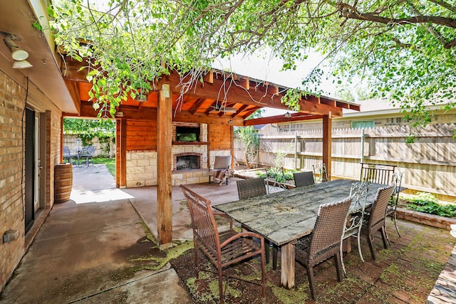 4410 Chandler Dr, Amarillo, TX 79109 - view of patio / terrace with an outdoor stone fireplace and ceiling fan