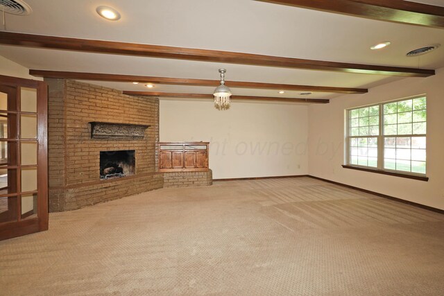 4410 Chandler Dr, Amarillo, TX 79109 - unfurnished living room with carpet floors, beamed ceiling, baseboards, recessed lighting, and a brick fireplace