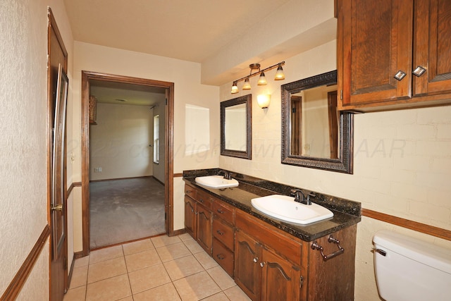 4410 Chandler Dr, Amarillo, TX 79109 - bathroom with double vanity and tile patterned flooring