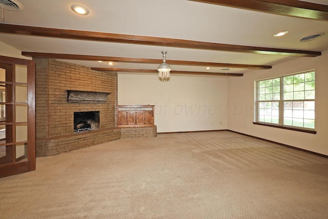 4410 Chandler Dr, Amarillo, TX 79109 - unfurnished living room with carpet floors, beamed ceiling, baseboards, recessed lighting, and a brick fireplace