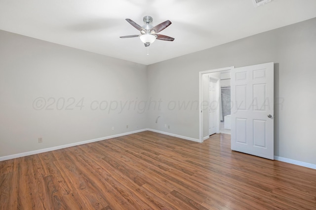 13701 Cedarwood Dr, Amarillo, TX 79118 - unfurnished bedroom featuring baseboards, wood finished floors, a walk in closet, a ceiling fan, and a closet