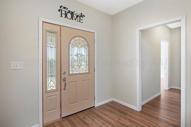 13701 Cedarwood Dr, Amarillo, TX 79118 - foyer featuring dark wood finished floors and baseboards