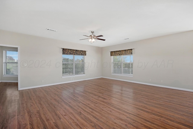 13701 Cedarwood Dr, Amarillo, TX 79118 - spare room featuring plenty of natural light, baseboards, and dark wood-style flooring