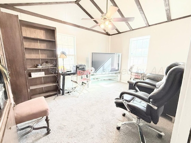 carpeted office featuring vaulted ceiling with beams and ceiling fan