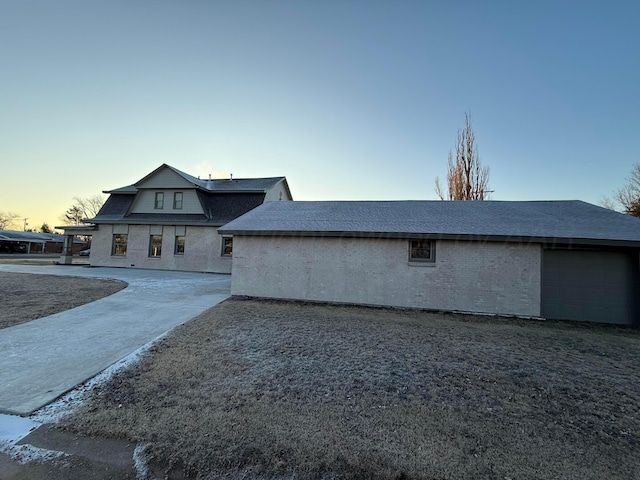 view of back house at dusk