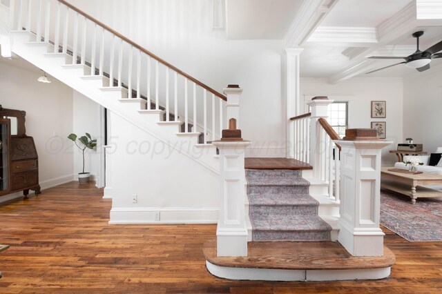 stairway featuring ceiling fan, coffered ceiling, beamed ceiling, crown molding, and hardwood / wood-style flooring