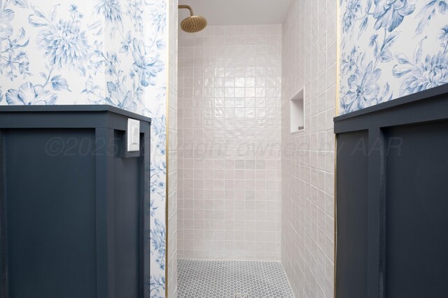 bathroom with a tile shower