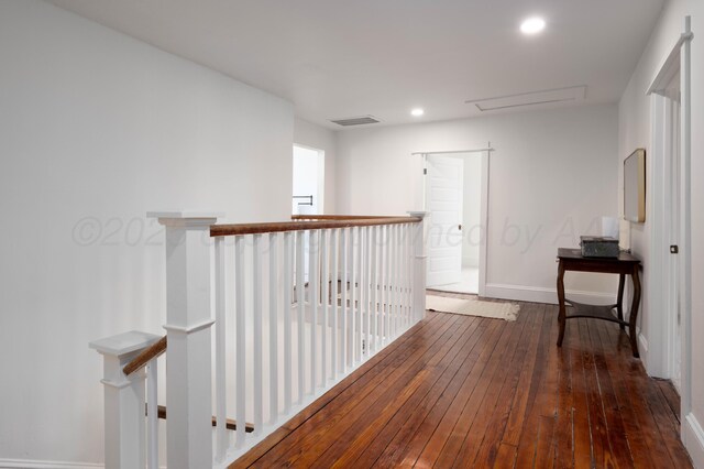 hall with dark hardwood / wood-style floors