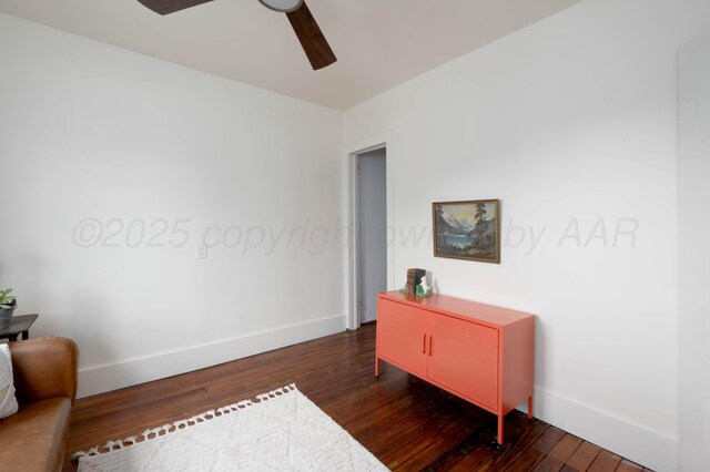 office area featuring ceiling fan and dark wood-type flooring