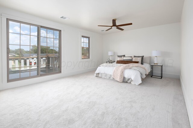 carpeted bedroom featuring ceiling fan