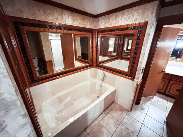 bathroom with a bath, tile patterned flooring, vanity, and ornamental molding