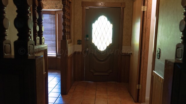 tiled foyer with a wealth of natural light