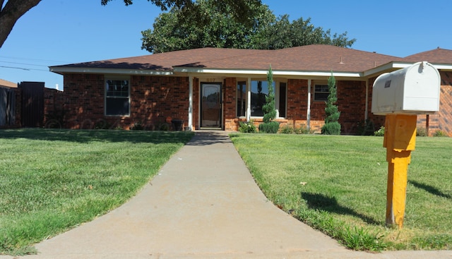 single story home with a front yard