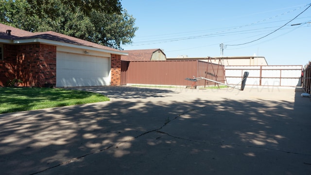 view of property exterior with a garage