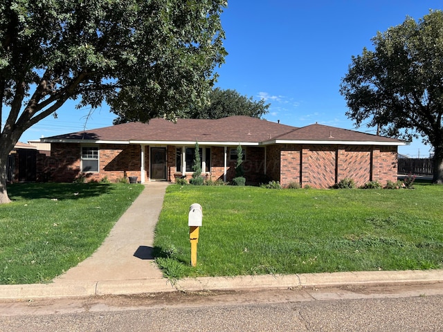 single story home with a front lawn