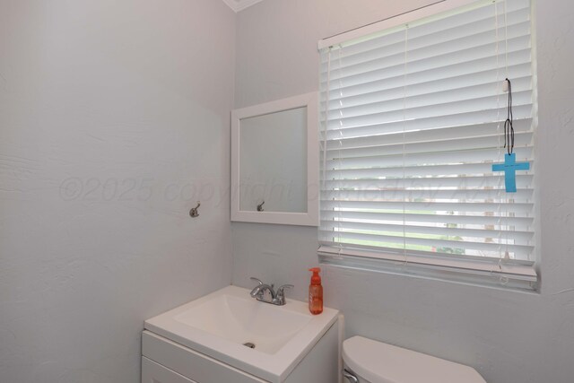 5109 Tawney Ave, Amarillo, TX 79106 - half bathroom featuring vanity and toilet