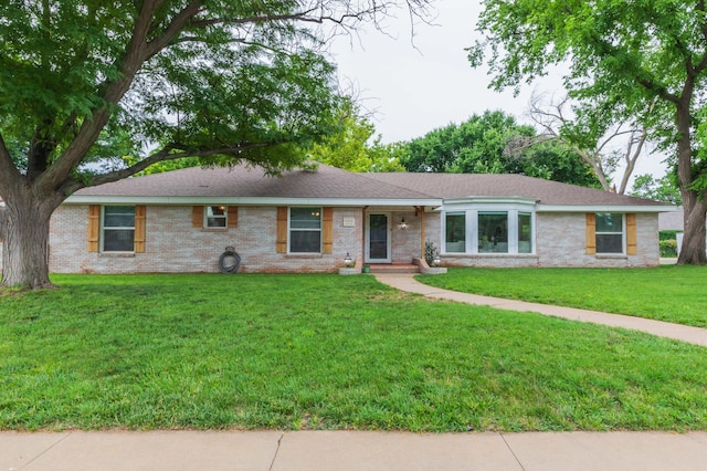 5109 Tawney Ave, Amarillo, TX 79106 - single story home featuring a front yard, brick siding, and a shingled roof