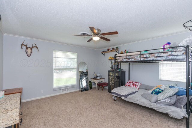 5109 Tawney Ave, Amarillo, TX 79106 - bedroom featuring crown molding, carpet floors, a textured ceiling, and a ceiling fan