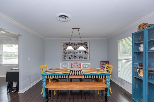 5109 Tawney Ave, Amarillo, TX 79106 - dining space featuring dark wood finished floors and ornamental molding