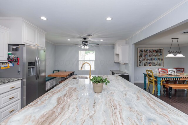 5109 Tawney Ave, Amarillo, TX 79106 - kitchen featuring stainless steel refrigerator with ice dispenser, ceiling fan, white cabinetry, light stone countertops, and recessed lighting
