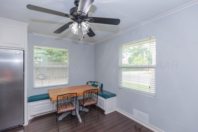 5109 Tawney Ave, Amarillo, TX 79106 - dining space with dark wood-type flooring, crown molding, plenty of natural light, and a ceiling fan