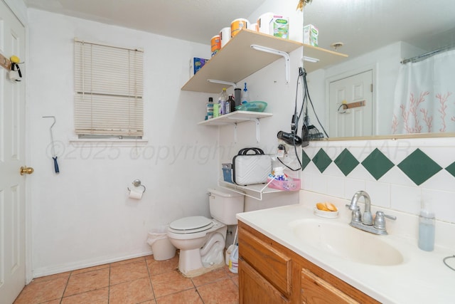 1411 N Highland St, Amarillo, TX 79107 - full bath with tasteful backsplash, vanity, toilet, tile patterned flooring, and a shower with curtain