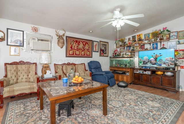 1411 N Highland St, Amarillo, TX 79107 - living area featuring a ceiling fan, wood finished floors, and a wall mounted air conditioner