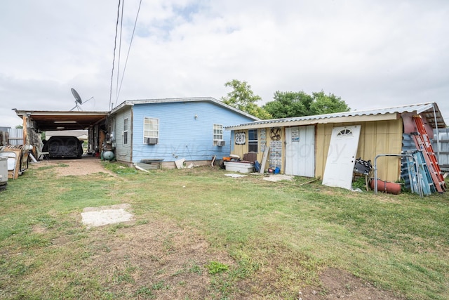 1411 N Highland St, Amarillo, TX 79107 - rear view of property with a lawn, cooling unit, and a carport