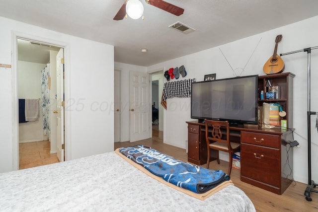 1411 N Highland St, Amarillo, TX 79107 - bedroom featuring wood finished floors, a ceiling fan, and connected bathroom