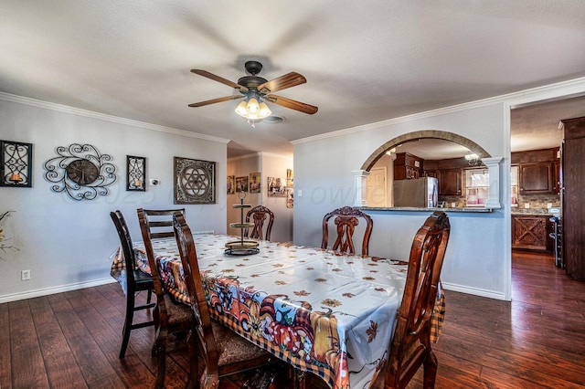 dining room featuring ceiling fan, dark hardwood / wood-style flooring, and crown molding