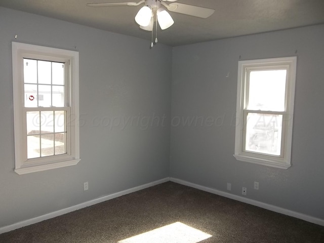 805 Brevard St, Hereford, TX 79045 - unfurnished room with healthy amount of natural light, dark carpet, and ceiling fan