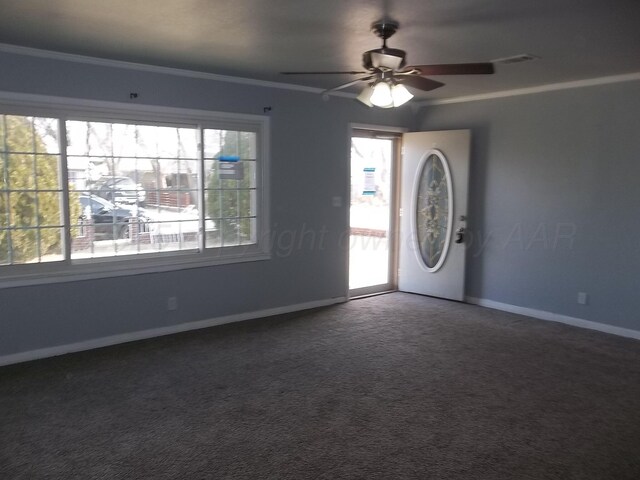 805 Brevard St, Hereford, TX 79045 - spare room featuring healthy amount of natural light, carpet flooring, crown molding, and a ceiling fan