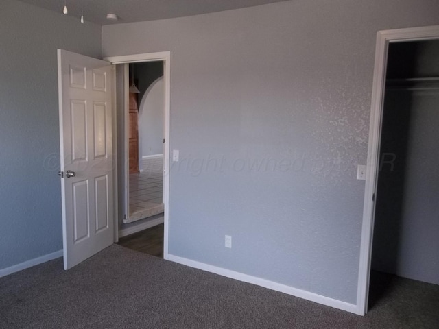805 Brevard St, Hereford, TX 79045 - unfurnished bedroom featuring carpet flooring, a closet, and a spacious closet