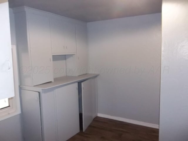 805 Brevard St, Hereford, TX 79045 - bar featuring dark wood finished floors and baseboards