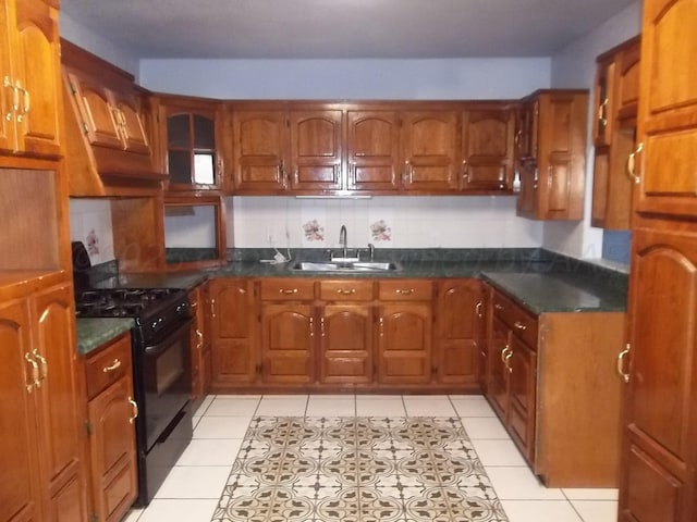 805 Brevard St, Hereford, TX 79045 - kitchen with black gas range and brown cabinets