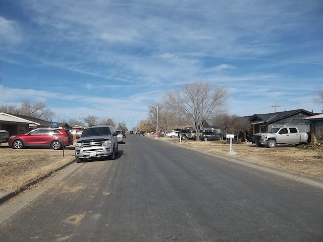 805 Brevard St, Hereford, TX 79045 - view of asphalt road featuring curbs and a residential view