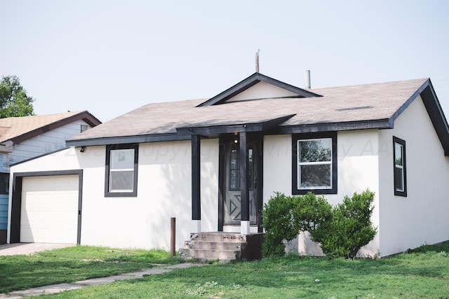 ranch-style house featuring a garage and a front yard